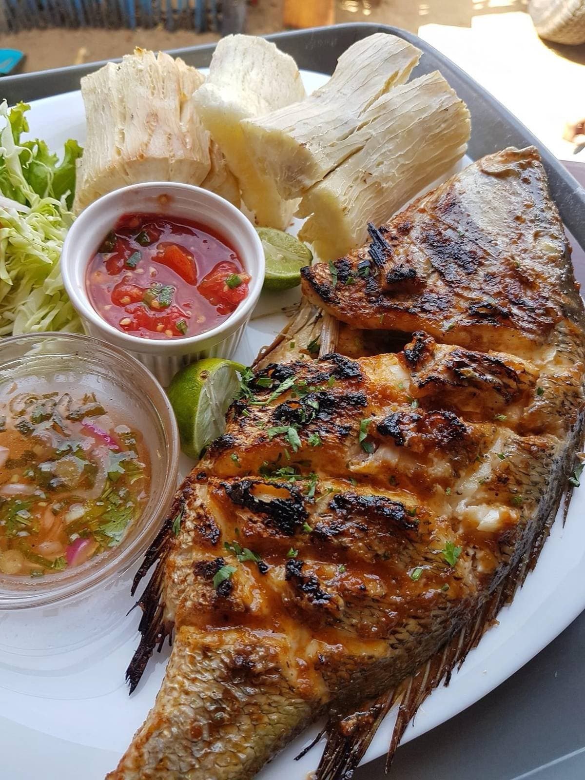 Grilled Fish with Charcoal, Cassava and Criolla Salsa